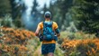 © G.Go - A runner wearing a hydration vest and backpack, showcasing essential trail running gear.