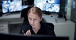 © peopleimages.com - CCTV, radio and security with woman in control room for law enforcement or surveillance. Communication, safety and talking with police officer at police headquarters for crime, inspection or privacy
