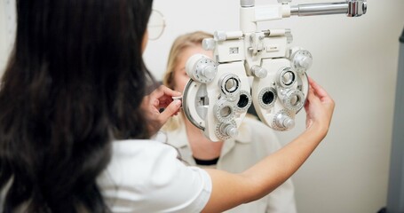 Poster - Doctor, optometry and woman on phoropter for eye care, consultation or health exam in clinic. Ophthalmologist, test or patient on lens machine tool for vision check, wellness and eyesight correction