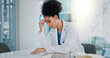 © peopleimages.com - Headache, doctor or woman with stress or documents in hospital clinic overwhelmed by emergency. Depression, sick or tired healthcare worker in office frustrated by migraine pain, paperwork or burnout