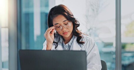 Canvas Print - Stress, doctor and Asian woman on laptop in hospital for medical service, telehealth and research. Healthcare, clinic and person on computer with headache, frustrated and burnout for mistake or fail