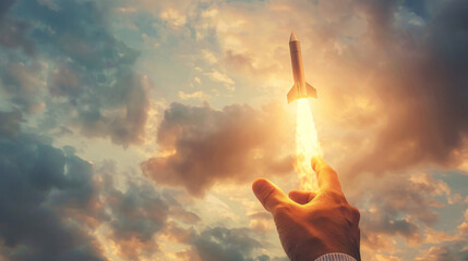 Aufkleber - Illustration of a hand launching a rocket towards a stunning sunset