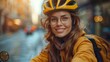 © familymedia - A cheerful young woman with glasses and a bike helmet takes a selfie on a city street at dusk