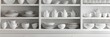 © NendeR - Dishware set in white shelving unit, tableware shelf, kitchen interior, clean white mugs, plates, glass tableware