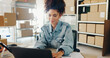 © Charlize Davids/peopleimages.com - Small business, smile and woman with laptop, retail and boxes for ecommerce, notification and shipping. Entrepreneur, owner and girl with computer, logistics and package for sales in warehouse