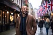 © Stocknterias - Portrait of a happy man walking on a street in London, UK