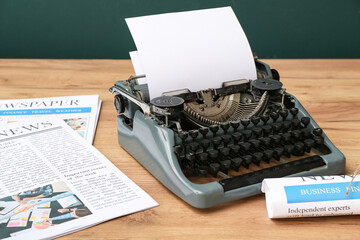 Sticker - Newspapers with vintage typewriter on wooden table