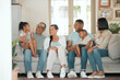 © peopleimages.com - Happy family, relax and together for reunion on sofa in living room for gathering, children and love. Support, celebrate and excited for holiday or vacation in home with kid and parents on couch