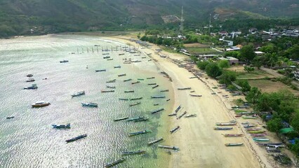 Wall Mural - Aerial view of wooden fishing boats off a tropical beach in Lombok