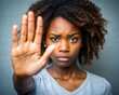 © Fernando Sanso - person, Young African American woman making hand stop denial gesture, saying no violence, abuse, abortion, showing palm, expressing prohibition, refusal, fighting against discrimination, bullying. Clo
