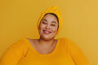 © lashkhidzetim - A woman with a yellow hat and a yellow shirt is smiling