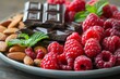 © Benjawan - A detailed photo of an antioxidant-rich snack plate with dark chocolate, almonds, and raspberries. Highlight the health benefits and the vibrant, appealing arrangement of antioxidant foods
