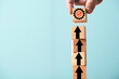 © Dilok - Hand putting mechanical gear and increasing graph on the top of up arrow for continuous productivity improvement to get business profit growth concept.