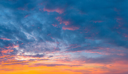 Wall Mural - Vibrant gorgeous sunset sky with colorful clouds background.