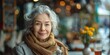 © Iryna - A friendly smile adorns the portrait of an elegant senior woman, seated outdoors at a cafe, radiating happiness