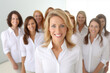 © My Beautiful Picture - Group of smiling white businesswomen at work on white background. Women in suits at work. Boss women. Image for graphic designer. Business world. Job recruitment.