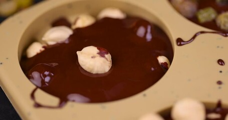 Wall Mural - making homemade chocolate with cocoa butter and nuts, making chocolate at home using various additives