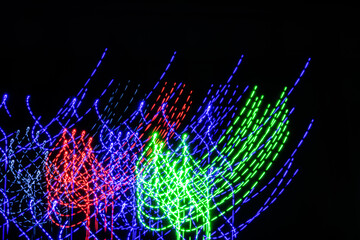 Wall Mural - a colorful light show with red, green, and blue lights. the lights are arranged in a way that create