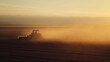 © PrabhjitSingh - Tractor Plowing a Field at Sundown with Dust Haze in the Air