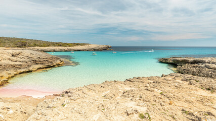 Wall Mural - View of a beautiful bay and a tiny beach with pink sand on Menorca Island in Spain, Holiday landscape, coast of Europe