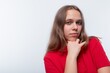 © Ivan Traimak - Caucasian girl with brown hair is wearing a red T-shirt
