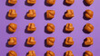 © Luluraschi - flat lay top view of pet food croquettes on purple background