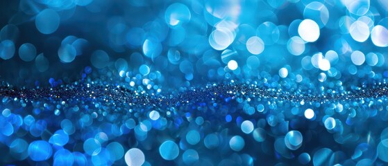 Wall Mural - A bright blue bokeh background with blurred lights, creating a festive and colorful atmosphere suitable for Christmas designs