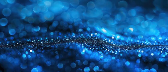 Wall Mural - A bright blue bokeh background with blurred lights, creating a festive and colorful atmosphere suitable for Christmas designs