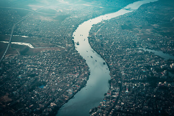 Wall Mural - aerial view of a city with a prominent river running through it