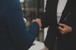 © Phanphen - Business handshake for teamwork of business merger and acquisition,successful negotiate,hand shake,two businessman shake hand with partner to celebration partnership and business deal concept