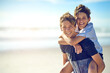 © Lyndon/peopleimages.com - Piggyback, portrait or boys at ocean with smile or love for fun summer vacation, holiday or playing. Siblings, mockup space or happy kids outdoors in Spain at beach or sea for travel or family memory
