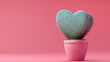© THINGDSGN - 3D of a heart-shaped cactus plant in a pink pot, set against a soft pink background, perfect banner for celebrating Valentines Day with a quirky and unique touch
