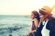 © peopleimages.com - Travel, friends and women at beach for holiday, summer vacation and bonding on weekend. Sunshine, nature and happy people with ocean view smile for adventure, thinking and relax together by seaside