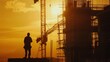 © patungkead - Silhouette of worker on building site, construction site