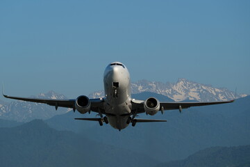 Wall Mural - The plane takes off at an airport in the mountains