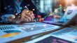 © Ganesha88 - analysis working with the latest financial results. Analysis of sales forecast graphs, financial accounting with hand writing Abstract digital effect for background