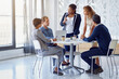 © peopleimages.com - Discussion, meeting and businesspeople with black woman leader, planning or teamwork in office. Collaboration, lawyer or diversity for litigation team, strategy or brainstorming for law firm employee