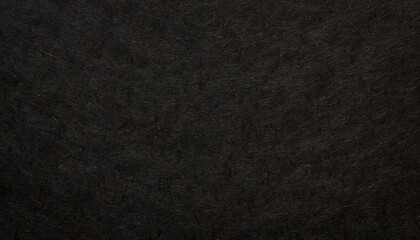 Dark, dusty, grainy, rough, earthy handmade black paper texture with visible fibers, for minimalistic art or backgrounds.