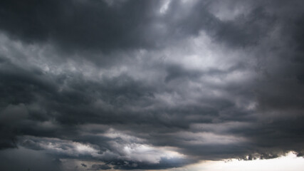 Aufkleber - The dark sky with heavy clouds converging and a violent storm before the rain.Bad or moody weather sky and environment. carbon dioxide emissions, greenhouse effect, global warming, climate change