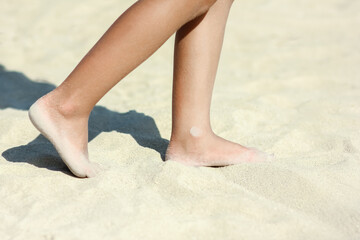 Wall Mural - A Feet and footprints by the seashore in nature travel vacation background