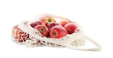 Wall Mural - String bag with apples isolated on white