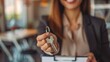 © FrankBoston - Woman realtor offering the keys of a new house to the client