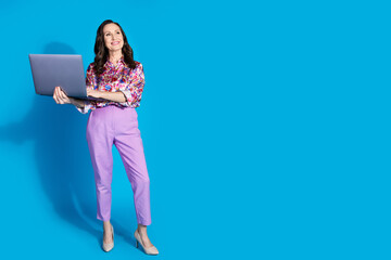 Poster - Photo of gorgeous retired lady wear trendy clothes hold netbook look empty space isolated on blue color background