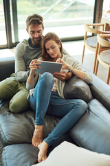 Sticker - Happy, couple and hug with tablet on sofa for streaming, movie subscription or tv selection at home. Smile, man and woman with tech and love embrace for bonding, show search and web entertainment