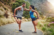 © peopleimages.com - Healthy, couple and fitness with stretching on mountain for race, preparation and training for marathon. Happy, man and woman with exercise in nature for cardio, flexibility or workout in New Zealand