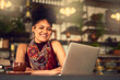 © peopleimages.com - Laptop, portrait and happy woman in cafe for remote work email, blog and article in restaurant. Computer, freelancer and face of copywriter in coffee shop on internet, website or customer in Brazil