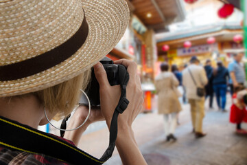 Female tourists taking photos at beautiful tourist attraction and people lifestyles.