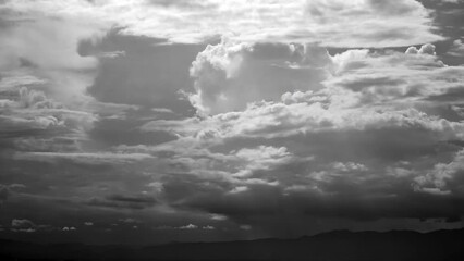 Wall Mural - time-lapse of separate white clouds on a black background have real clouds. time-lapse of White cloud isolated on a black background realistic cloud. time-lapse of white fluffy cumulus cloud isolated