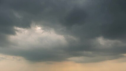 Wall Mural - dramatic sky with storm cloud on a cloudy day time lapse at the ocean.