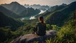 © Den Boro Day - Cat Ba National Park Top of the Hill Young Woman enjoys beautiful view from the Ngu Lam peak in Kim Giao forest,.